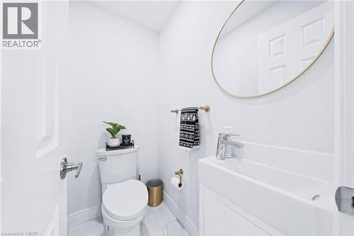 main level powder room for convenient hand washing before meals l - 46 Novoco Drive, Hamilton, ON - Indoor Photo Showing Bathroom