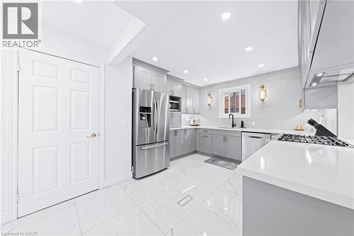 spacoius kitchen with white and gray colour scheme - 46 Novoco Drive, Hamilton, ON - Indoor Photo Showing Kitchen With Upgraded Kitchen