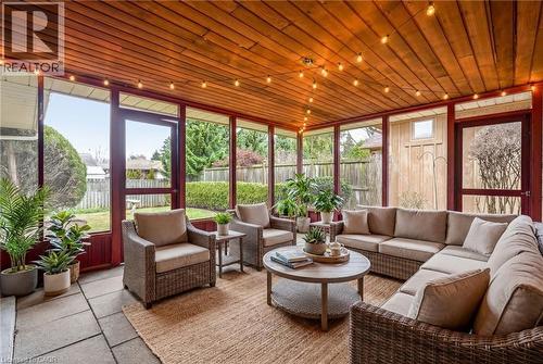 Sunroom / solarium featuring wood ceiling - 890 Falcon Boulevard, Burlington, ON - Indoor Photo Showing Living Room