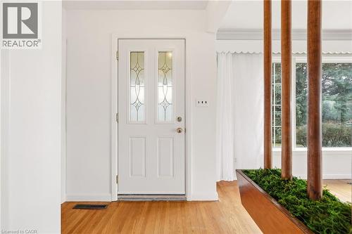 Foyer entrance with light wood-style floors - 890 Falcon Boulevard, Burlington, ON - Indoor Photo Showing Other Room