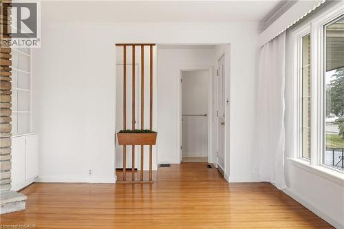 Empty room featuring light wood finished floors and ornamental molding - 890 Falcon Boulevard, Burlington, ON - Indoor Photo Showing Other Room
