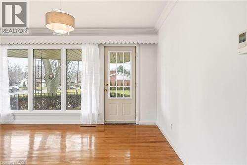 Doorway featuring ornamental molding and wood finished floors - 890 Falcon Boulevard, Burlington, ON - Indoor Photo Showing Other Room