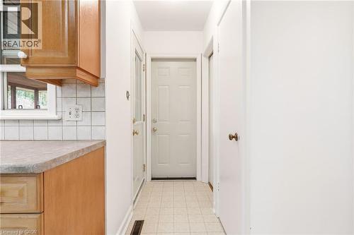 Doorway with tile patterned floors and baseboards - 890 Falcon Boulevard, Burlington, ON - Indoor Photo Showing Other Room