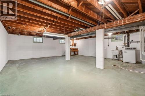 Basement featuring washer / dryer and a sink - 890 Falcon Boulevard, Burlington, ON - Indoor Photo Showing Basement