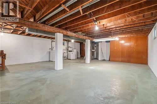Unfinished below grade area with independent washer and dryer - 890 Falcon Boulevard, Burlington, ON - Indoor Photo Showing Basement