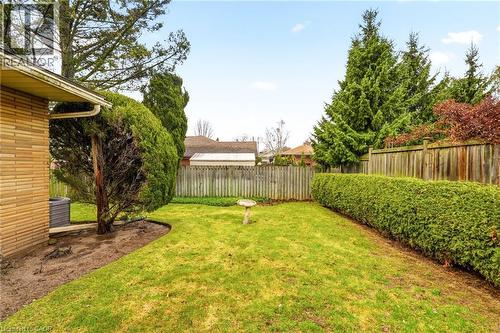View of fenced backyard - 890 Falcon Boulevard, Burlington, ON - Outdoor With Backyard