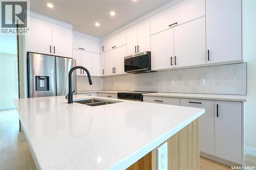 2475 Mcara Street, Regina, SK - Indoor Photo Showing Kitchen With Double Sink With Upgraded Kitchen