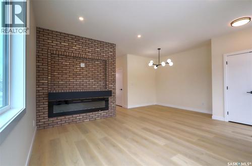 2475 Mcara Street, Regina, SK - Indoor Photo Showing Living Room With Fireplace