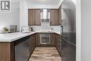 Modern and sleek kitchen. - 2081 Fairview Street Unit# 1402, Burlington, ON  - Indoor Photo Showing Kitchen With Upgraded Kitchen 