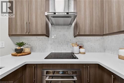 Beautifully designed. - 2081 Fairview Street Unit# 1402, Burlington, ON - Indoor Photo Showing Kitchen