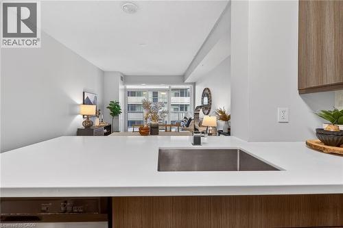 Open concept through dining room and living room. - 2081 Fairview Street Unit# 1402, Burlington, ON - Indoor