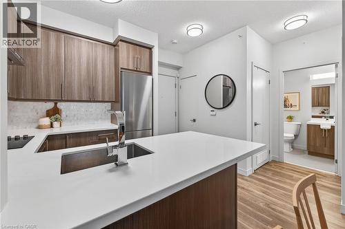 Kitchen overview. - 2081 Fairview Street Unit# 1402, Burlington, ON - Indoor Photo Showing Kitchen With Upgraded Kitchen