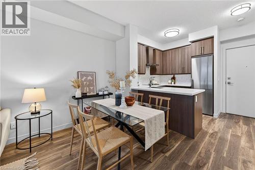 Accommodates table/chairs for a more comfortable dining option. - 2081 Fairview Street Unit# 1402, Burlington, ON - Indoor Photo Showing Other Room