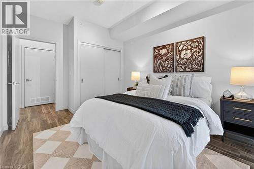 Spacious bedroom could easily accommodate a King Sized bed. - 2081 Fairview Street Unit# 1402, Burlington, ON - Indoor Photo Showing Bedroom