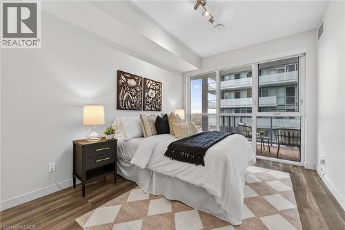 A comfortable room to retire to at the end of the day. - 2081 Fairview Street Unit# 1402, Burlington, ON - Indoor Photo Showing Bedroom