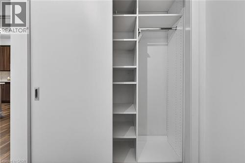Another view of the closet organizer. - 2081 Fairview Street Unit# 1402, Burlington, ON - Indoor Photo Showing Other Room