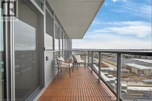 The floor tiles on the balcony ensure a more comfortable outdoor space to relax and enjoy the views. - 2081 Fairview Street Unit# 1402, Burlington, ON - Outdoor With Balcony With View With Exterior