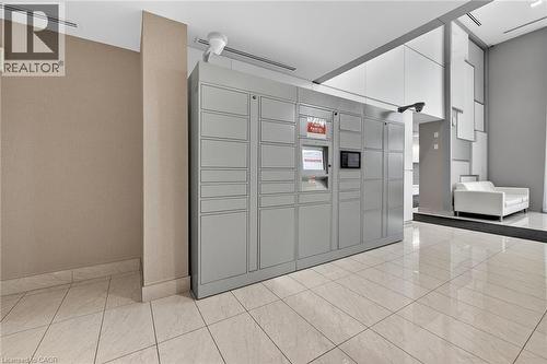 The lobby features Automated Smart Parcel Locker. Convenient and secure for package deliveries. - 2081 Fairview Street Unit# 1402, Burlington, ON - Indoor