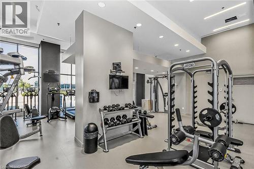 Fully equipped indoor gym.  There is also an outdoor gym. - 2081 Fairview Street Unit# 1402, Burlington, ON - Indoor Photo Showing Gym Room