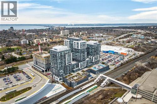 Areal views of the building and views of the lake. - 2081 Fairview Street Unit# 1402, Burlington, ON - Outdoor With View