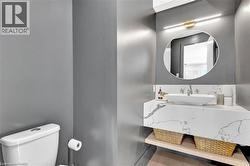 Bathroom with vanity and toilet - 