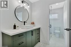 Bathroom featuring vanity and a shower stall - 