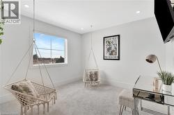 Sitting room with carpet floors and baseboards - 