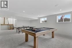 Game room with light colored carpet, recessed lighting, and billiards - 