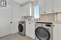 Laundry area with cabinet space and washer and dryer - 