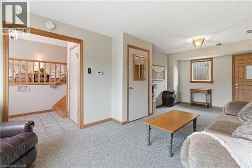 Family room with light carpet and stairway - 135 Burbank Road, Kitchener, ON - Indoor Photo Showing Living Room