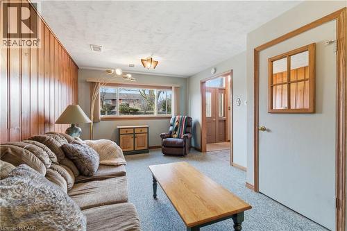 Family room with light coloured carpet and a textured ceiling - 135 Burbank Road, Kitchener, ON - Indoor Photo Showing Other Room
