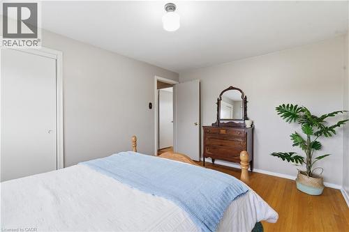 Bedroom featuring wood finished floors and baseboards - 135 Burbank Road, Kitchener, ON - Indoor Photo Showing Bedroom