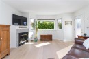 #204-9725 Fourth St, Sidney, BC  - Indoor Photo Showing Living Room With Fireplace 