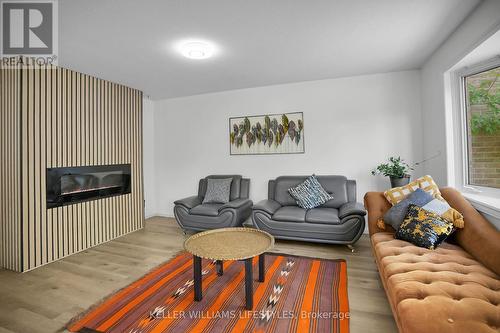 4 - 230 Clarke Road, London East (East H), ON - Indoor Photo Showing Living Room With Fireplace