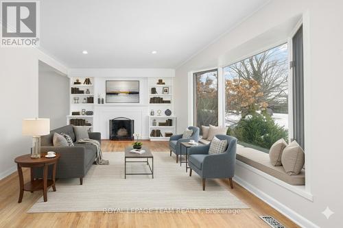 Virtually staged. - 2358 Malone Crescent, Ottawa, ON - Indoor Photo Showing Living Room With Fireplace