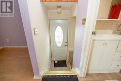 Side Entrance with Access to the Lower Level. - 