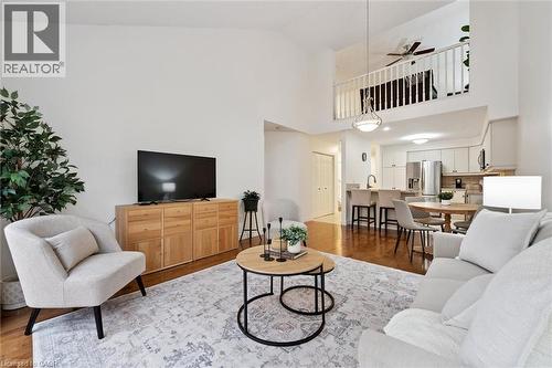 Living room with light wood-style floors, ceiling fan, and high vaulted ceiling - 92 Schroder Crescent, Guelph, ON - Indoor Photo Showing Living Room