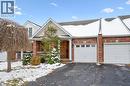 View of front of home featuring brick siding, driveway, and an attached garage - 92 Schroder Crescent, Guelph, ON  - Outdoor 