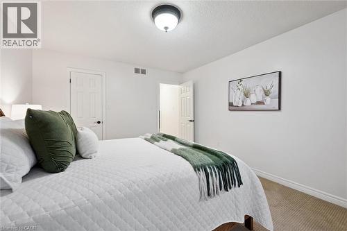 Bedroom with carpet flooring and a textured ceiling - 92 Schroder Crescent, Guelph, ON - Indoor Photo Showing Bedroom