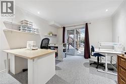 Office space with light colored carpet, recessed lighting, and crown molding - 