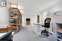 Office with light colored carpet, crown molding, and recessed lighting - 