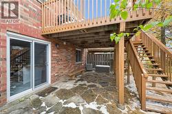 View of patio / terrace with stairway and a wooden deck - 