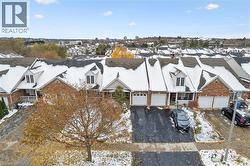 Snowy aerial view featuring a residential view - 
