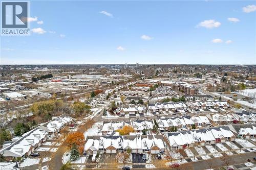 Aerial overview of property's location featuring nearby urban area and nearby suburban area - 92 Schroder Crescent, Guelph, ON - Outdoor With View