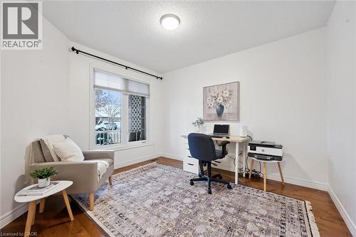 Office space featuring wood finished floors and a textured ceiling - 92 Schroder Crescent, Guelph, ON - Indoor Photo Showing Office