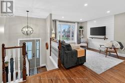 Bright and inviting, with hardwood flooring - 