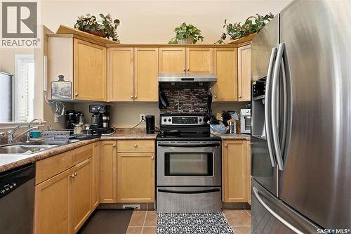 1007 Cypress Way, Regina, SK - Indoor Photo Showing Kitchen With Stainless Steel Kitchen With Double Sink