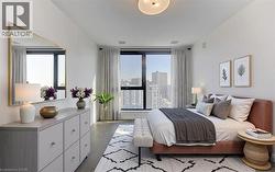 Bedroom featuring wood finished floors and a view of city - 