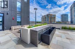 View of patio featuring a city view and a sink - 