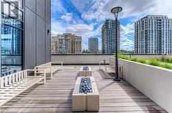 Deck with a view of city and an outdoor living space - 